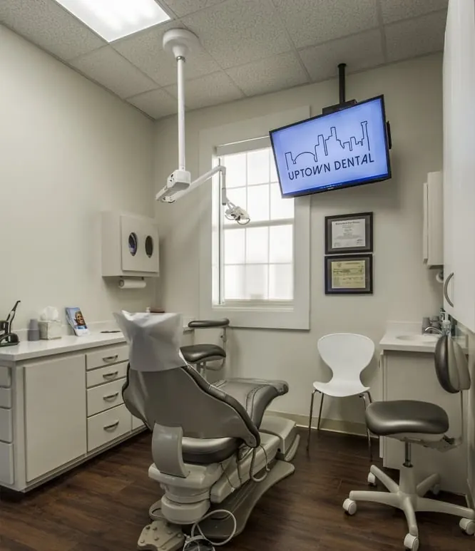 A treatment room at Uptown Dental, with the dental chair beside the window.